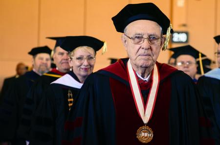 Hyran Barefoot, Union University's 14th president, walks in the processional line during the start of the inauguration ceremony of Union's 16th president, Samuel W. "Dub" Oliver at the G.M. Memorial Savage Chapel. - Photo by Kathleen Murray