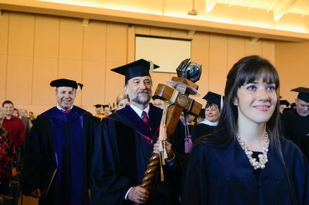 Jenaye White, right, SGA president, walks in the processional line with Hal Poe, faculty member of the year, and Dub Oliver during the start of the inauguration ceremony at the G.M. Memorial Savage Chapel. - Photo by Kathleen Murray
