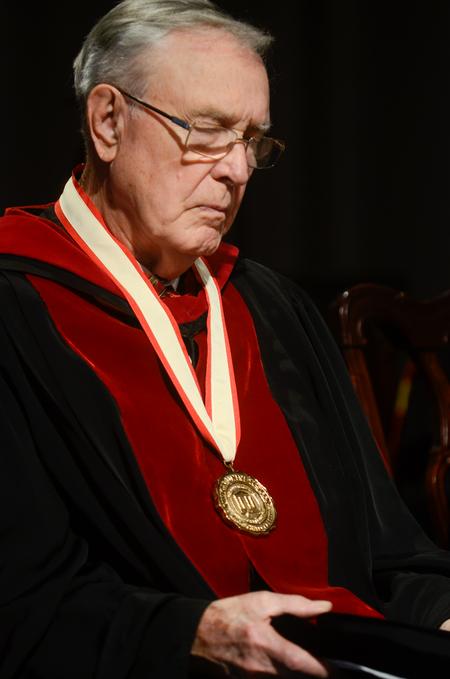 Hyran Barefoot, Union University's 14th president prays during the 16th presidential inauguration ceremony of Samuel W. "Dub" Oliver, at the G.M. Memorial Savage Chapel. - Photo by Kathleen Murray