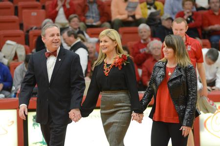 Dub Oliver, Union University's 16th president, his wife, Susie, and his daughter, Callie, are recognized at half time of the Homecoming game.  - Photo by Emily Stookey
