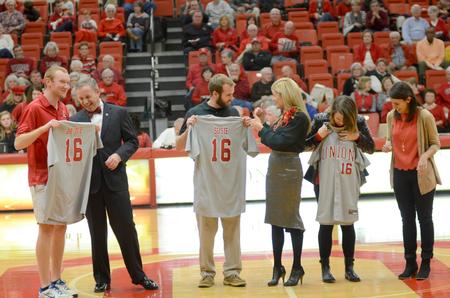 Union University's 16th president, Dub Oliver, and his family receive personalized Union jerseys as an official welcome gift from the inauguration committee.  - Photo by Emily Stookey