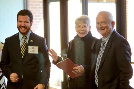 Guests mingle in the hallway before entering the presidential inauguration of Dub Oliver, the university's 16th president. - Photo by Emily Stookey