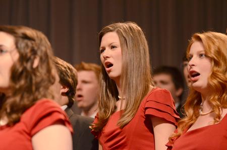 Catherine Guthrie, sophomore elementary education major, sings with the University Singers during Dub Oliver's presidential inauguration. - Photo by Emily Stookey