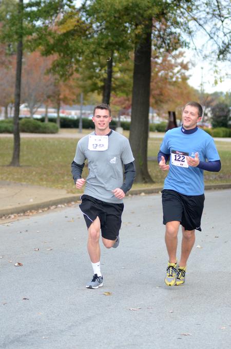 Andrew Bigelow, junior biology major, and Eli Hurt, senior biology major, run in the Make-a-Wish 5K. - Photo by Meg Rushing