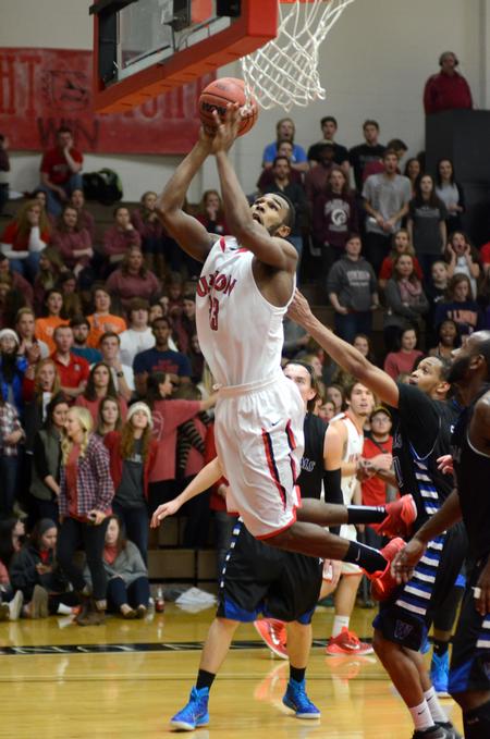 Junior guard Jordan Montgomerey goes for a lay-up in the homecoming game. - Photo by Meg Rushing