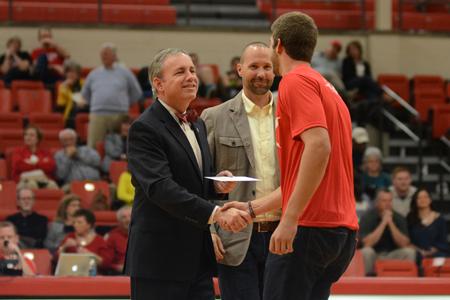 Members of the Union Jaxx ultimate frisbee team accept the award for second place in the President's Cup competition at the homecoming game in Fred delay Gymnasium. - Photo by Meg Rushing