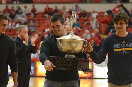 The men of Sigma Alpha Epsilon receive the President's Cup at the Homecoming game in Fred delay Gymnasium. - Photo by Meg Rushing