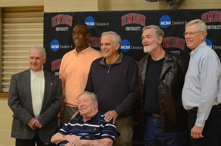 The 1968 basketball team gathers for a NCAA reception to celebrate homecoming weekend. - Photo by Meg Rushing