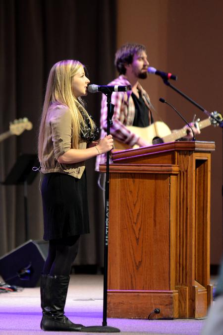 Emily Shoemaker, junior psychology major, sings in a chapel service. - Photo by Meg Rushing