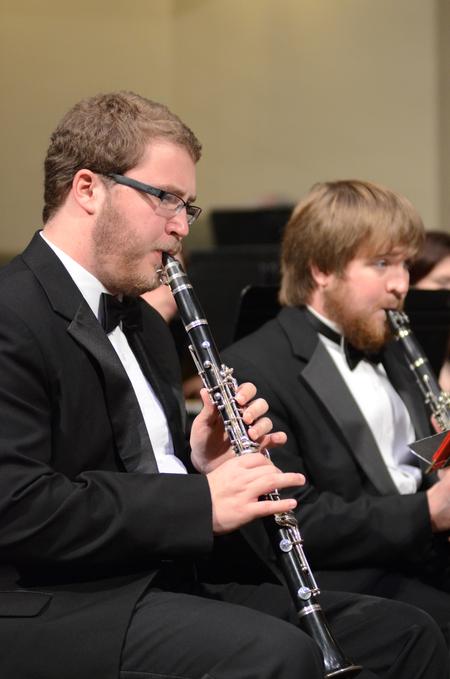Jordan Mathenia, sophomore music major, and Blake Giles, senior music theory major, play the clarinet in Union University's Symphonic Band concert. - Photo by Emily Stookey