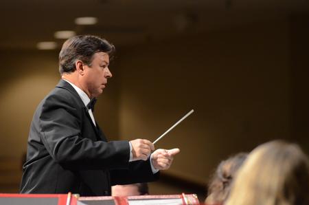 Michael Mann, professor of music, conducts the symphonic band during their annual concert at First Baptist Jackson. - Photo by Emily Stookey