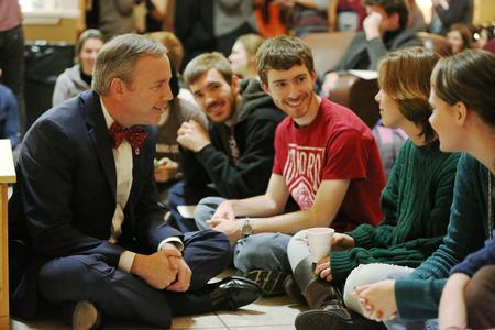 Dub Oliver, president of the university, chats with students prior to Christmas with the Olivers. - Photo by Kristi McMurry Woody