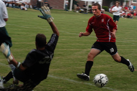 Kyle Sanders (red) prepares for a shot in Union's win over Delta State University. - Photo by Jonathan Blair