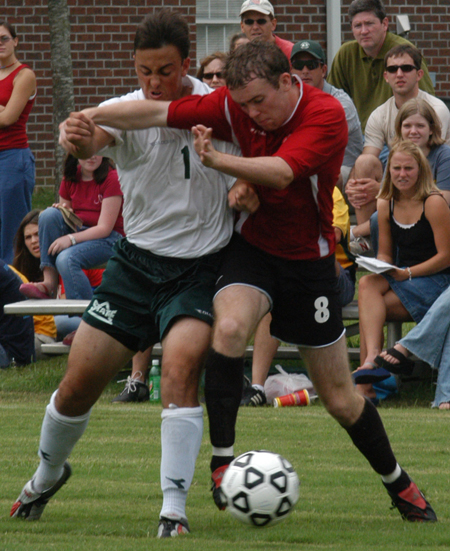 Benny Crozier (8) battles a Delta State player for ball possesion. - Photo by Jonathan Blair