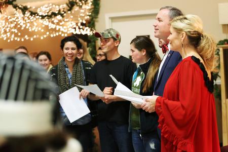 Dub and Susie Oliver, president and first lady of the university, join students in McAfee Commons for Christmas carols and story time during Christmas with the Olivers. - Photo by Kristi McMurry Woody