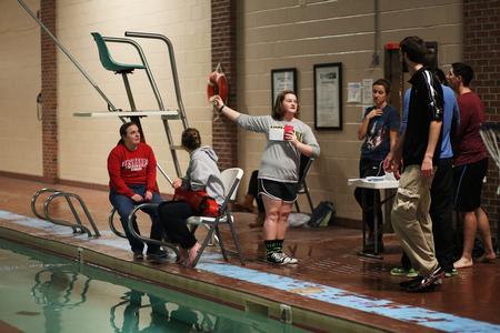Elizabeth Neal (center), sophomore social work major, explains the final challenge in the Amazing Race event that was hosted by res-life. - Photo by Kristi McMurry Woody