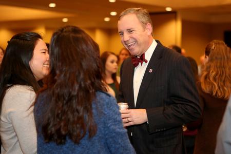 Dub Oliver, president of the university, mingles with the students who made the President's List in fall of 2014. The students were honored with a reception.  - Photo by Kristi McMurry Woody
