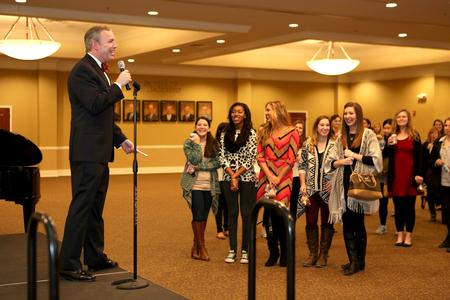 Dub Oliver, president of the university, congratulates President's List scholars on their achievement.  - Photo by Kristi McMurry Woody