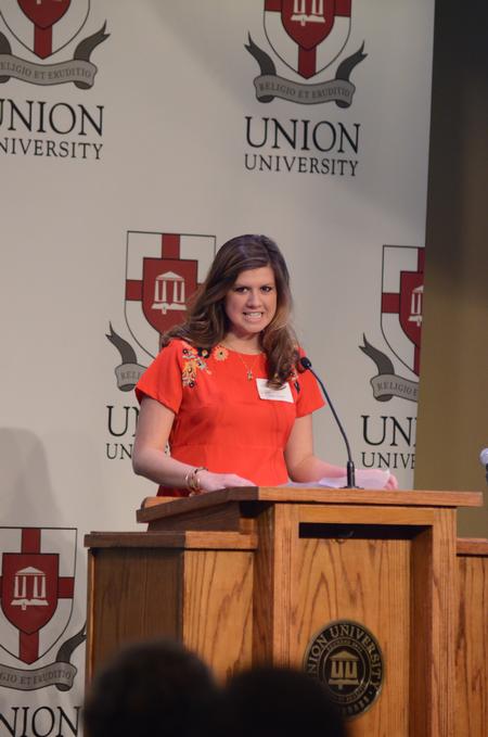Katie Green, sophomore nursing major, shares her testimony of being a pastor's daughter at the West Tennessee Pastors and Wives Valentine's Banquet. - Photo by Meg Rushing