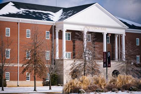 Providence Hall with a bit of snow on the roof and ground. - Photo by Kristi McMurry Woody