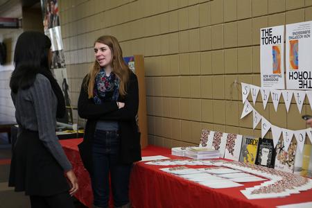 Students chat about The Torch, a student organization participating in the Student Organization Fair.  - Photo by Kristi McMurry Woody