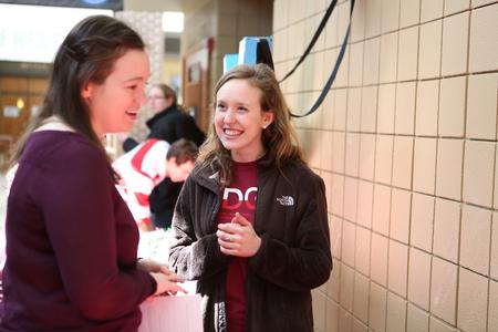 Students chat and learn more about various organizations at the Student Organization Fair in the SUB hallway. - Photo by Kristi McMurry Woody