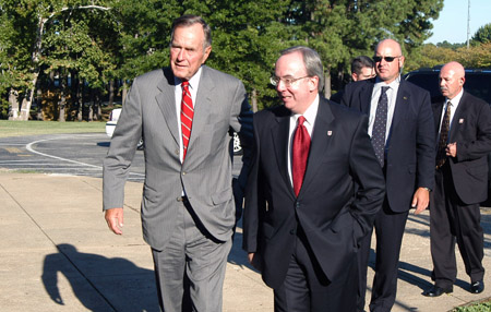Former President George H.W. Bush arrives on the campus of Union University and is escorted into Penick Academic Complex by Union President David S. Dockery.  - Photo by Morris Abernathy