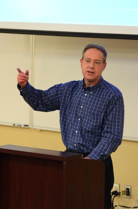 Henry Allen, visiting assistant professor of history, talks about Christianity and Liberalism by John Gresham Machen at a Town and Gown Event. - Photo by Meg Rushing