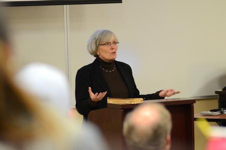 Nancy Thomas, associate director of the center for faculty development, shares about My Name is Asher Lev by Chaim Potok at a Town and Gown Event. - Photo by Meg Rushing