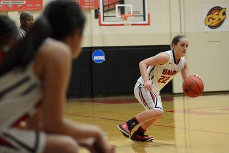 Amy Philamlee, senior sports medicine major, dribbles down the court during the NCAA Division II Women's Basketball South Region Championship Game.  - Photo by MiKalla Cotton