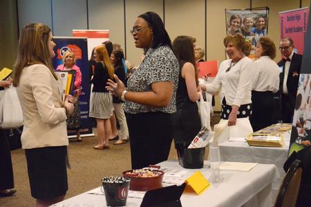 Students discuss job opportunities with representatives during the teacher expo hosted by the Vocatio Center in the Carl Grant Events Center. - Photo by MiKalla Cotton