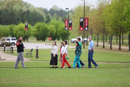 A tour group crosses in front of the bell tower on a Preview Day. - Photo by Kristi McMurry Woody