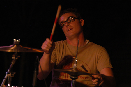 Jesse Hornbeak plays drums in Jason Fitt's band during Fall Fest '04. - Photo by Jonathan Blair