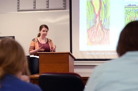 Samantha Tucker, junior art major, presents during the art section of the Scholarship Symposium in the Penick Academic Complex. - Photo by MiKalla Cotton