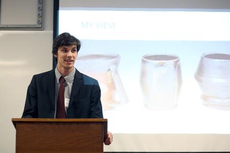 Andrew Clark, senior art major, shares his influences in pottery and sculpture during his presentation at the Twelfth Annual Scholarship Symposium. - Photo by Amanda Rohde