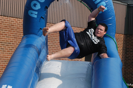Freshman Jeff McCormick experiments with his technique on the aqua slide during Fall Fest '04. - Photo by Jonathan Blair