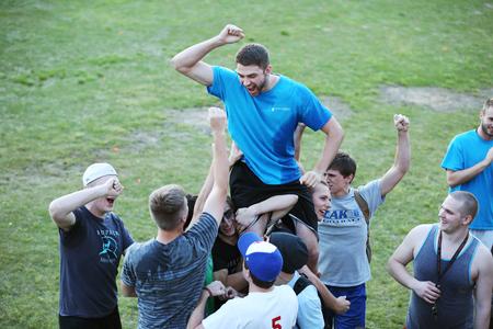 The men of Grey celebrate winning the 2015 Union Cup after Res Life's Field Day.  - Photo by Kristi McMurry Woody