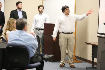 A group of MBA students on the Germantown campus makes a presentation to a local non-profit at the end of their 2-year program. - Photo by Kristi McMurry Woody