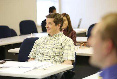 Students in the MBA program on the Germantown campus enjoy their evening class with Steve Arendall. - Photo by Kristi McMurry Woody