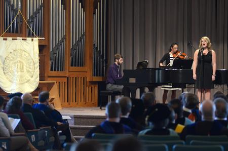 Logan Brasher, senior music major, Paige Tang, senior music major, and Hillarie Henderson, senior music education major, perform at the opening of Awards Day Chapel.  - Photo by MiKalla Cotton