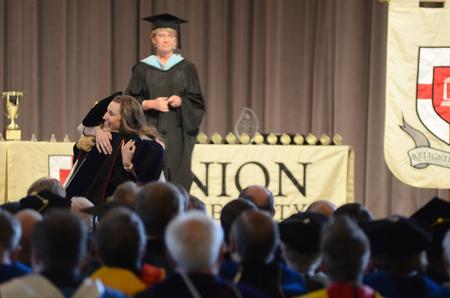 Rachel Wukasch, senior family studies major, receives the academic excellence award in family studies during Awards Day chapel. - Photo by MiKalla Cotton