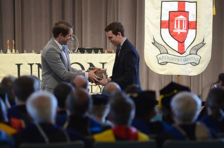Caleb Valentine, senior biblical studies and languages major, receives the Broadman and Holman award during the Awards Day Chapel.  - Photo by MiKalla Cotton