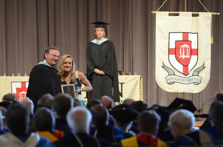 Amy Philamlee, senior sports medicine major, receives the Fred Delay Memorial award during Awards Day Chapel.  - Photo by MiKalla Cotton