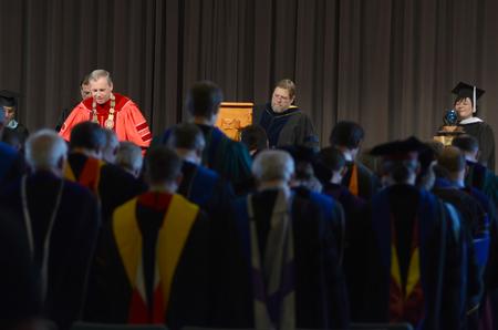 Dub Oliver, president of the university, prays the benediction prayer concluding the Awards Day Chapel.  - Photo by Michael Winn