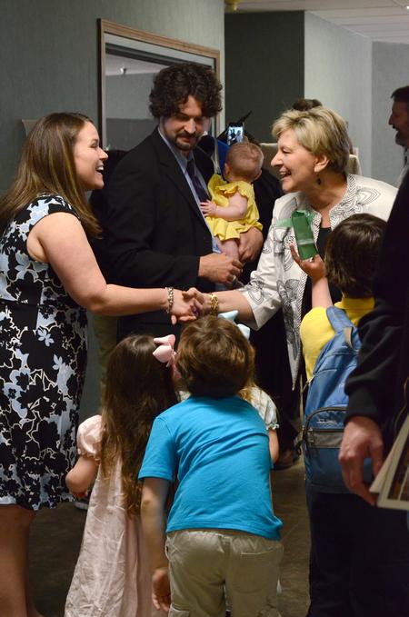 Staff congratulate the family of Scott Heit, assistant vice president for university communications, for receiving the 2015-2016 Gary L. Carter Staff of the Year award, following Awards Day Chapel. - Photo by MiKalla Cotton