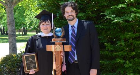 Ashley Blair, 2015-2016 Carla D. Sanderson Faculty of the Year, and Scott Heit, 2015-2016 Gary L. Carter Staff of the Year, pose for a photo following Awards Day Chapel. - Photo by MiKalla Cotton
