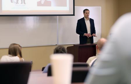 Phil Davignon, assistant professor of sociology, speaks on "Marital Conflict: The Fight Over Marriage and Its Implications for Families, Children and Society" at the Town and Gown lecture series. - Photo by Amanda Rohde