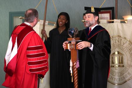 Hal Poe (right), Charles Colson Professor of Faith & Culture, watches his colleagues line up for the processional into Awards Day chapel. - Photo by Kristi McMurry Woody