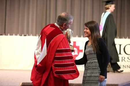 Dub Oliver, president of the university, presents the women of Chi Omega with the Greek Scholarship cup for the 68th year in a row. - Photo by Kristi McMurry Woody