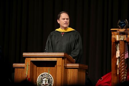 Gary Carter, senior vice president for business services, announces the 2015 Staff Member of the Year.  - Photo by Kristi McMurry Woody